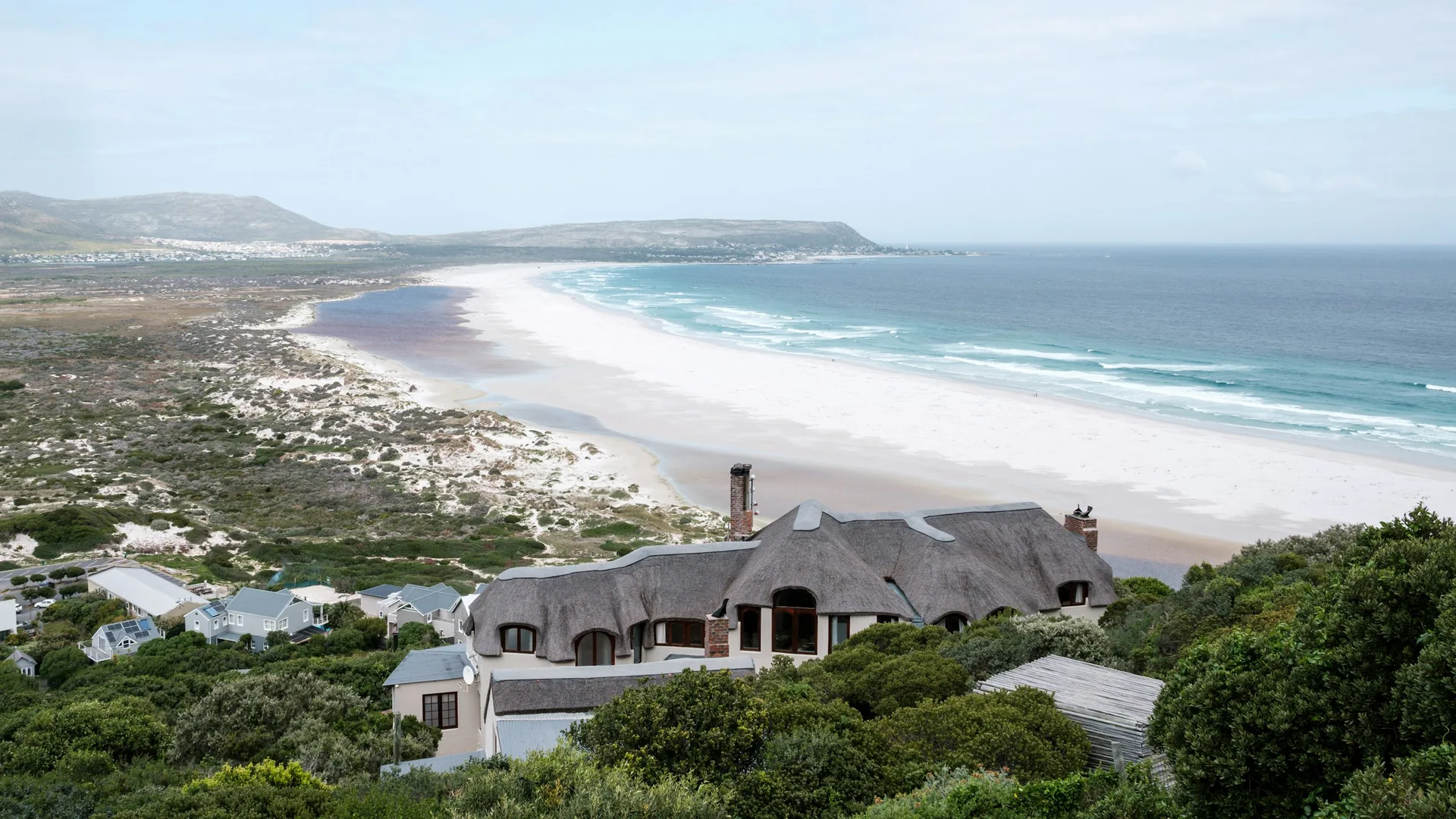 The rugged coastline of the Cape Peninsula meeting the ocean near Cape Point, South Africa